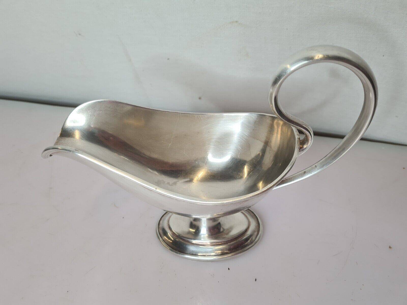 silver metal gravy boat