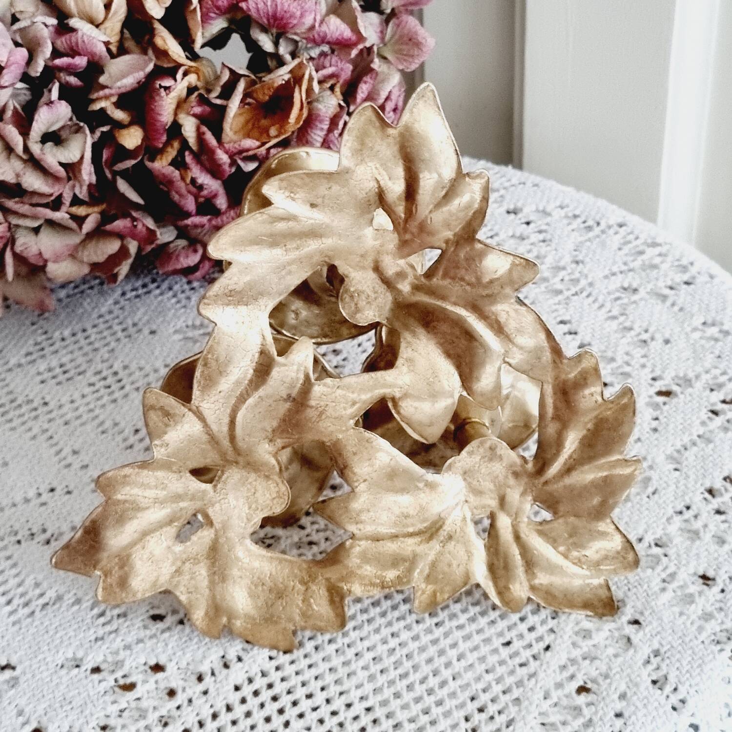Low brass flower candle holder