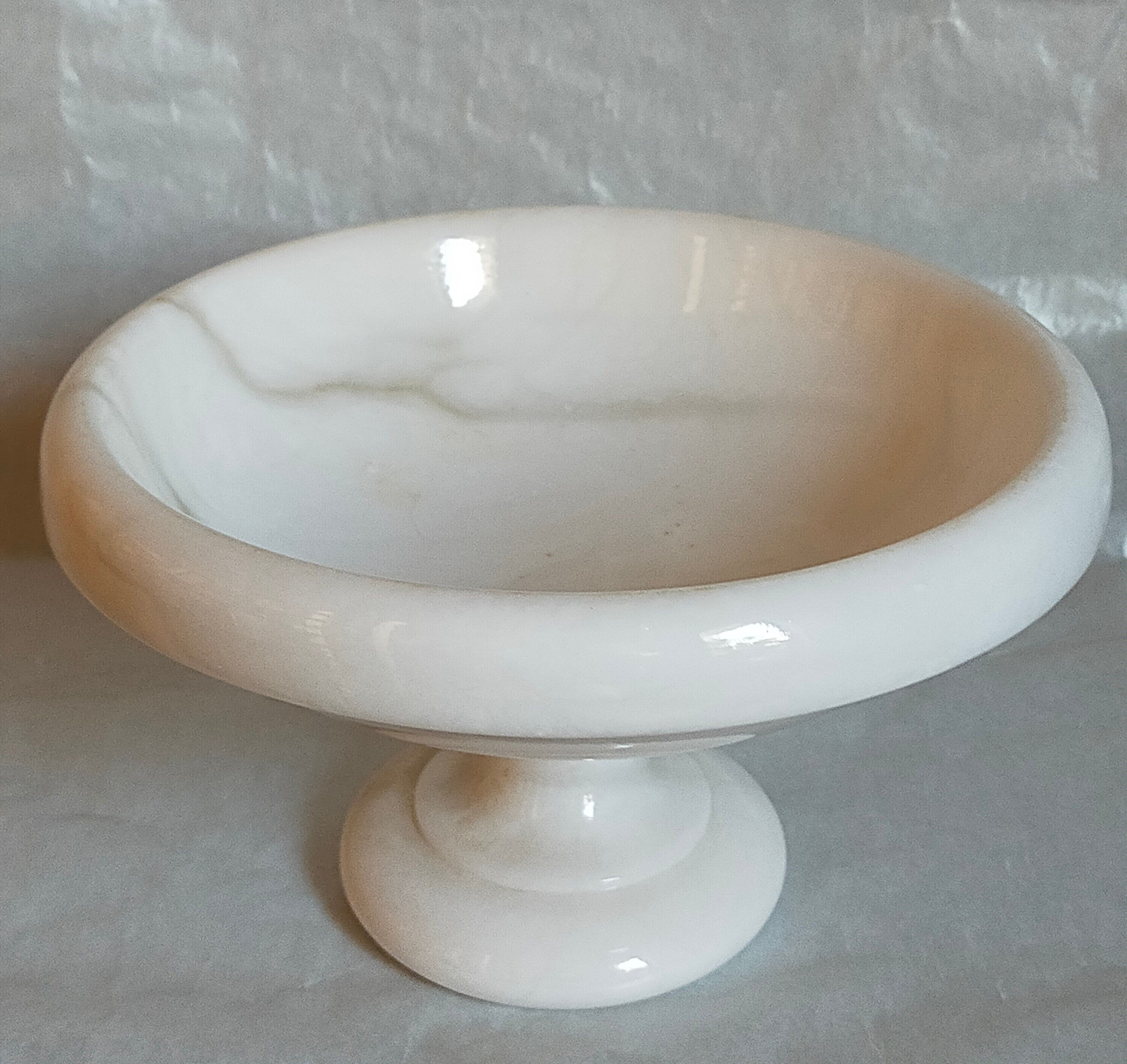 Standing cup in old white marble