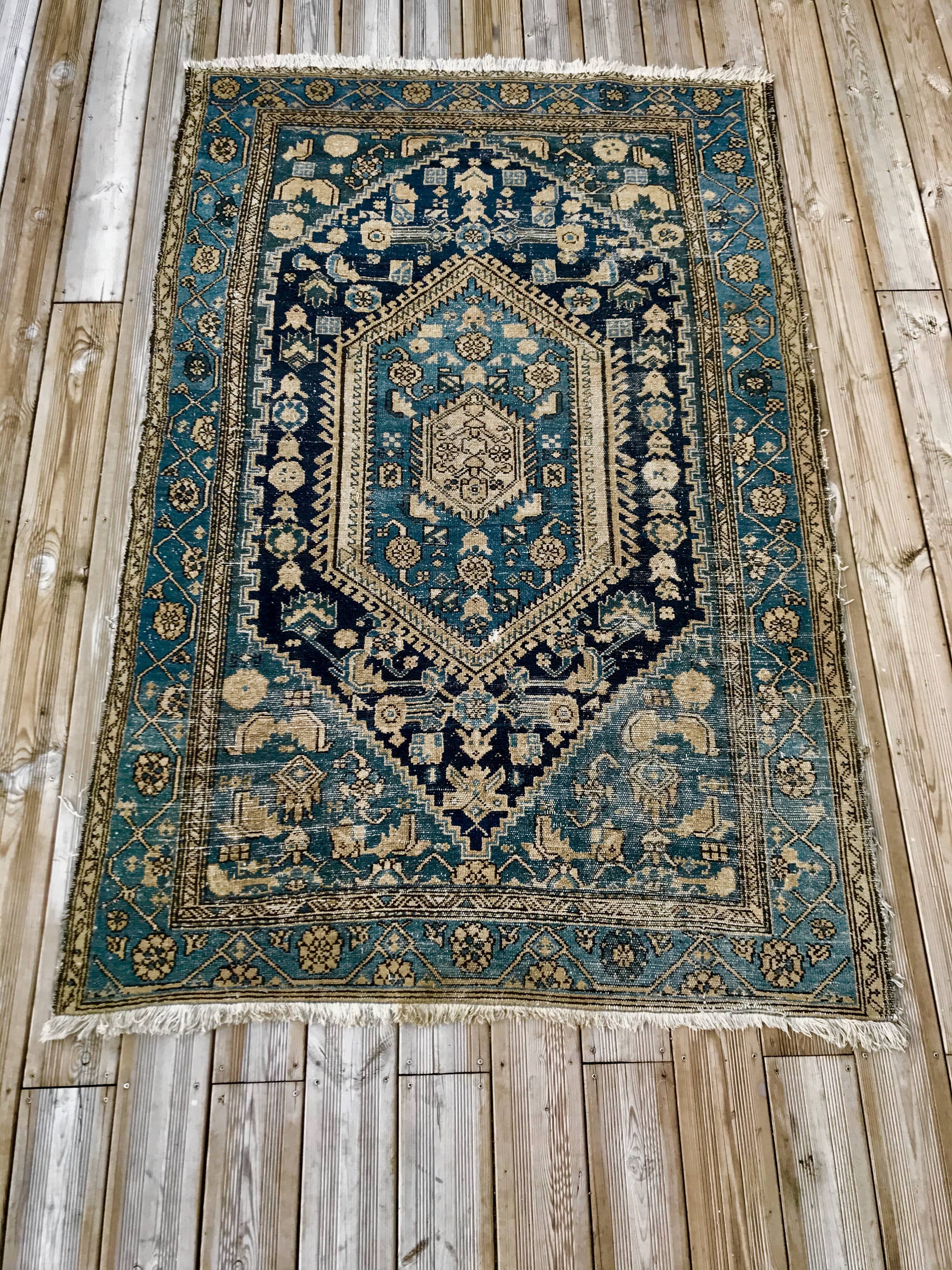 Persian carpet old green background, hand knotted, certified