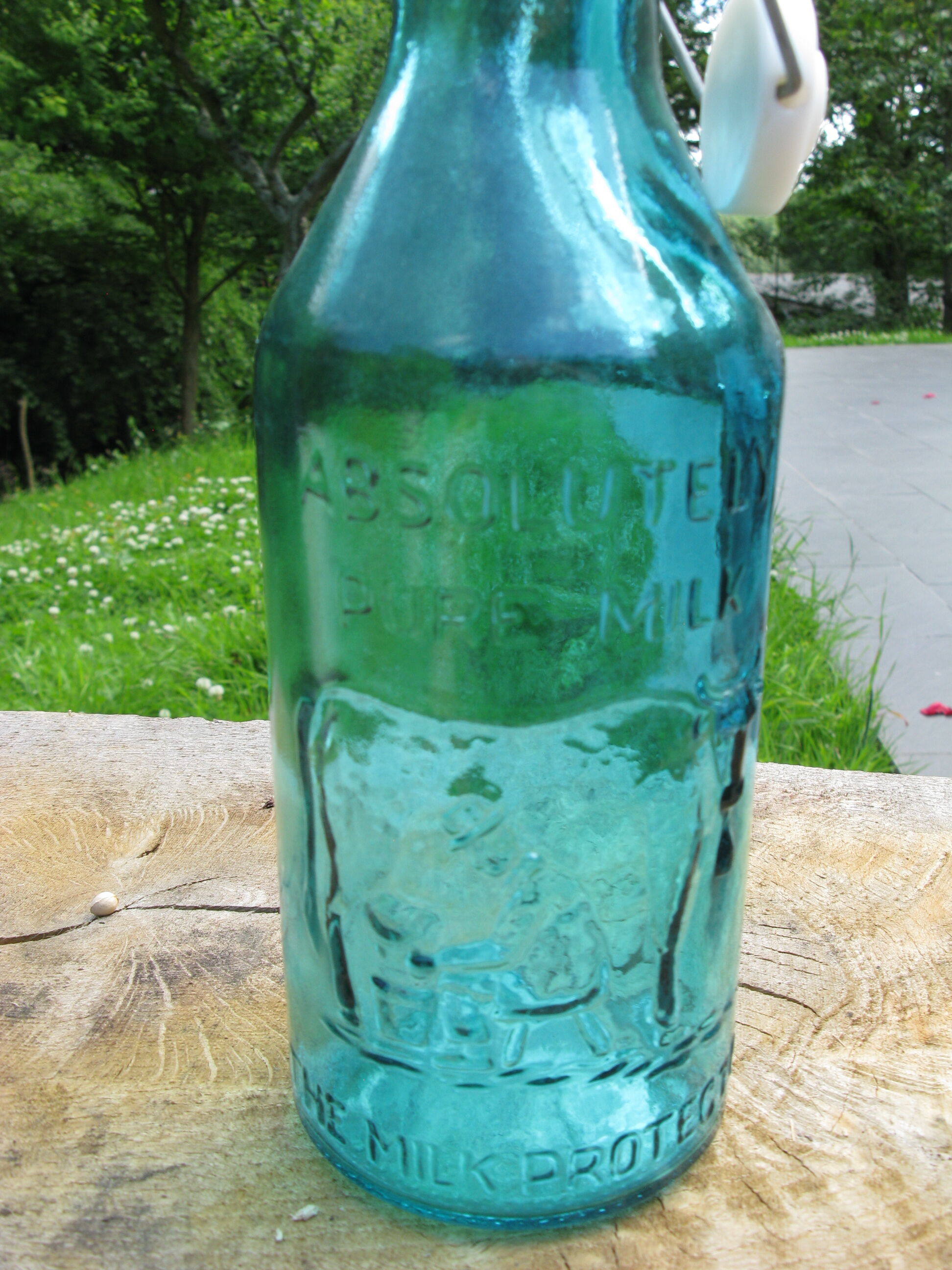Blue glass milk bottle