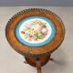 Antique walnut coffee table with painted ceramic insert, 20th century.