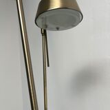 Golden metal floor lamp with reading light