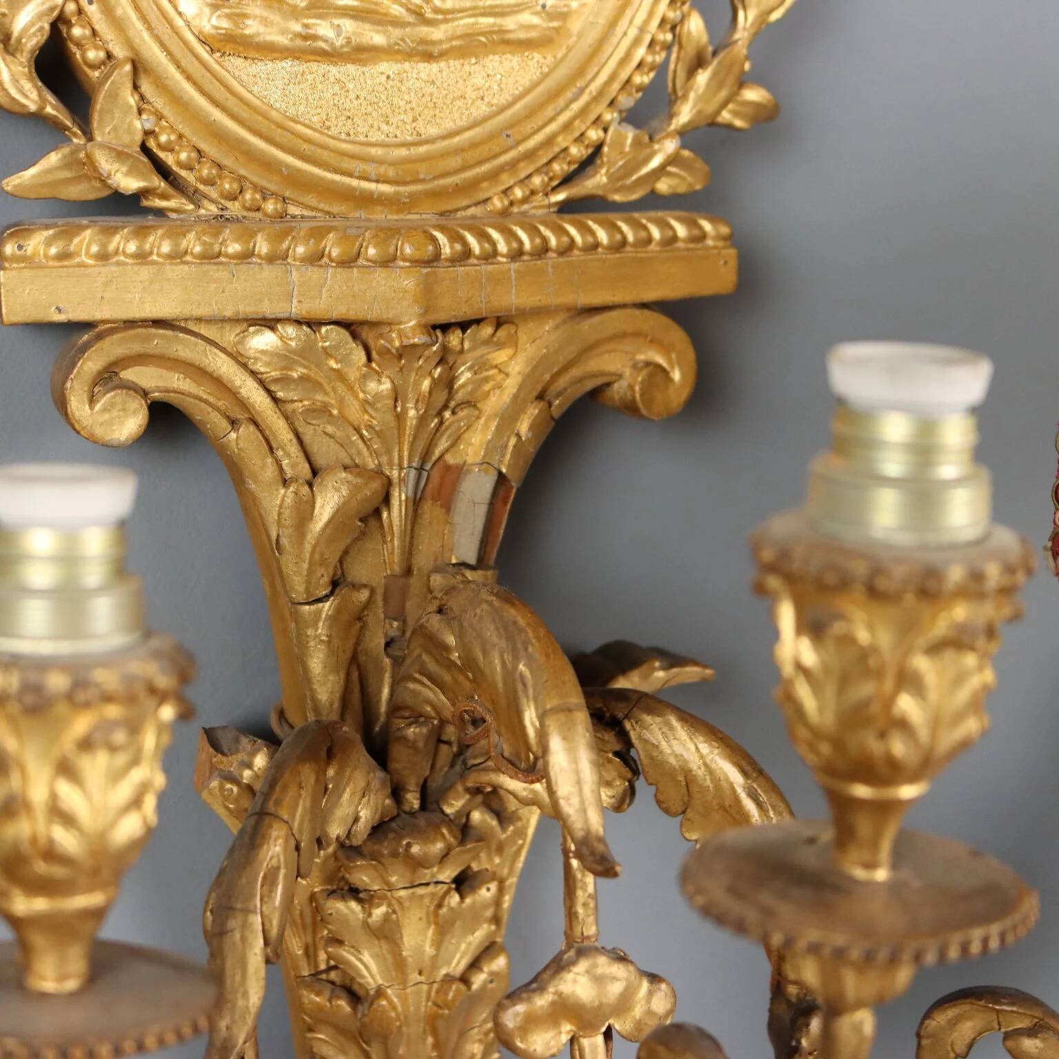 Antique neoclassical wall sconces in iron and wood, 19th century.