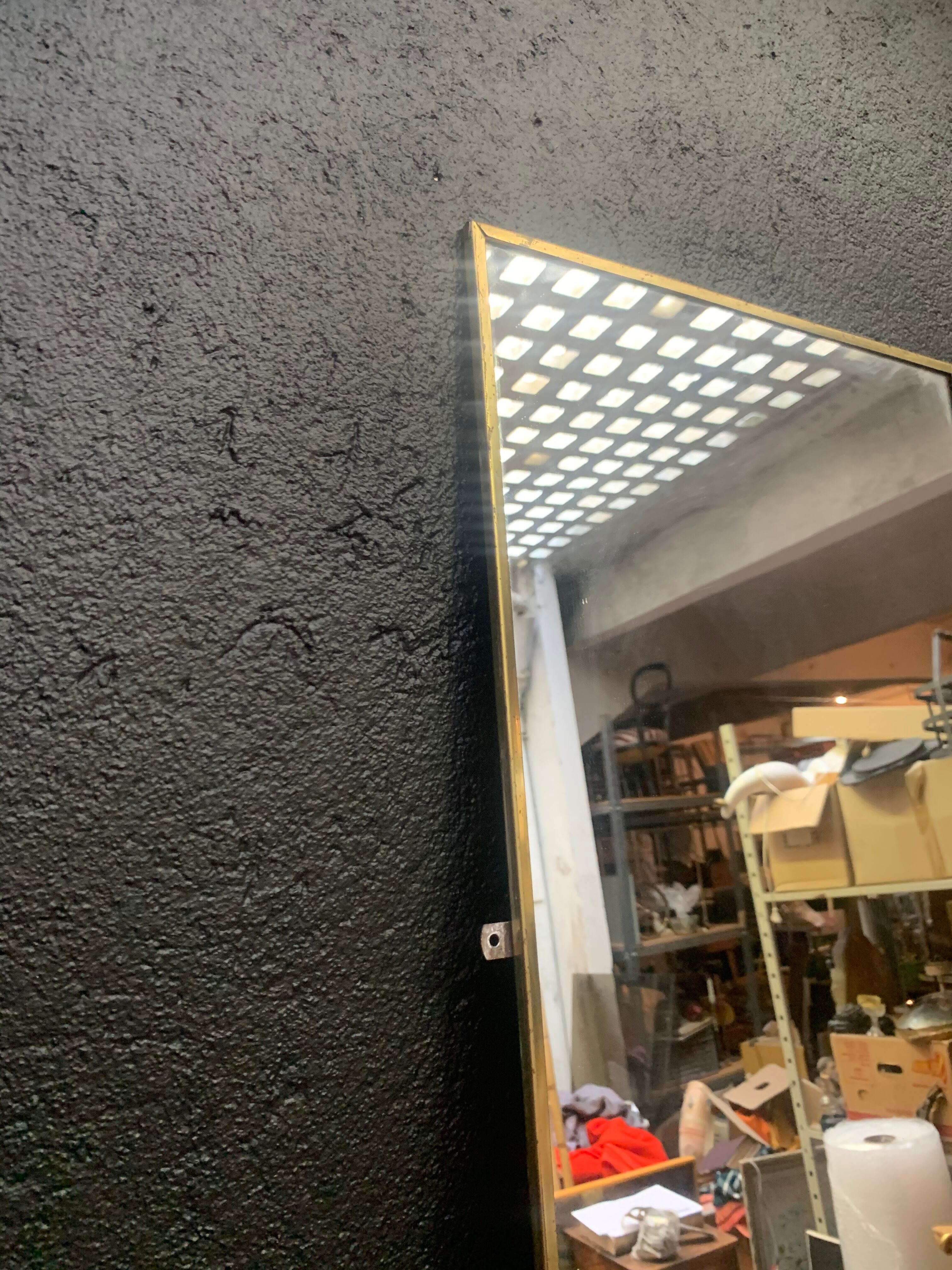 Mirror of two, narrow glass in gold metal 1950