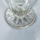 Glass pitcher on base