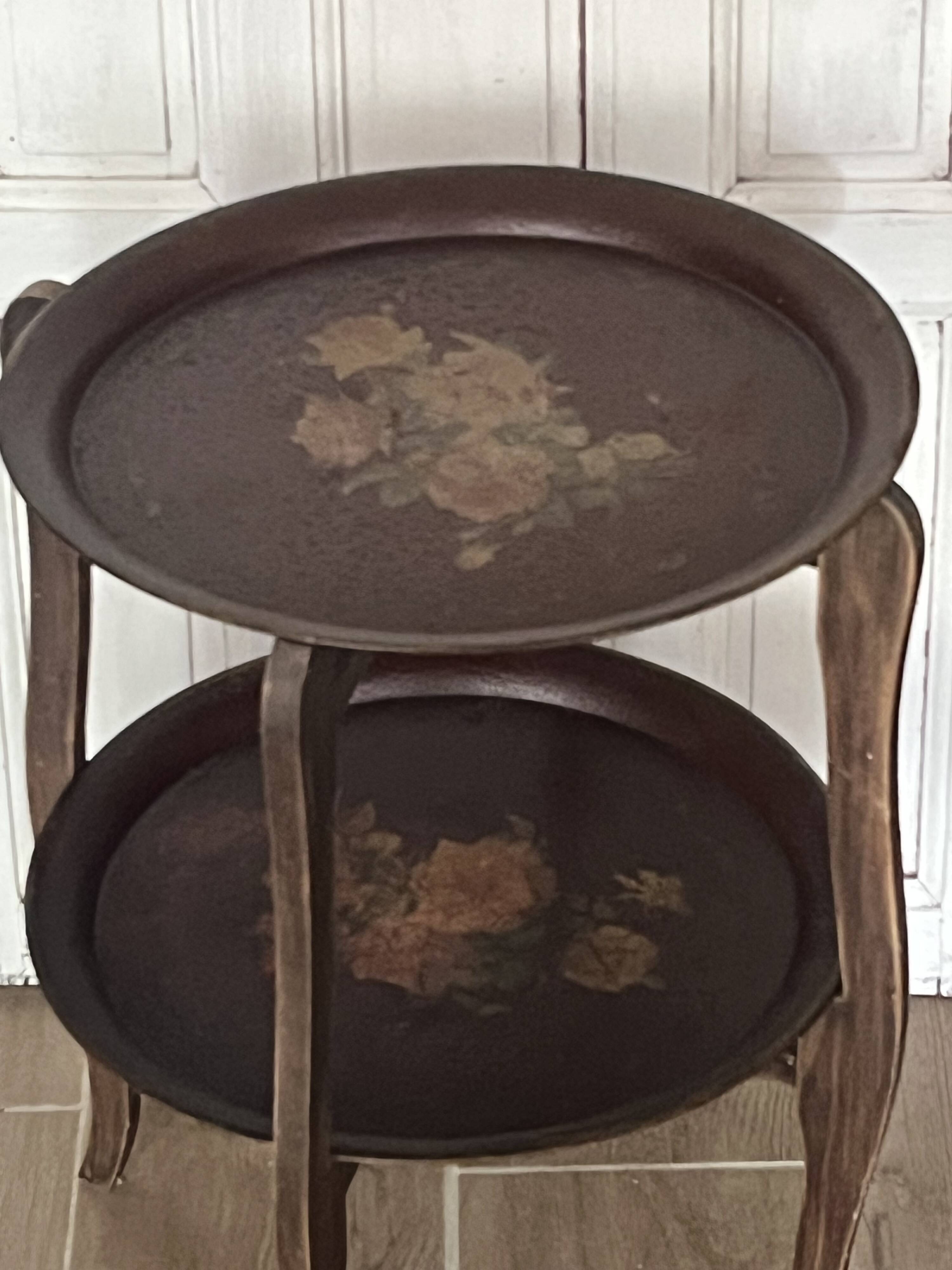 Two old trays on a stand/console.