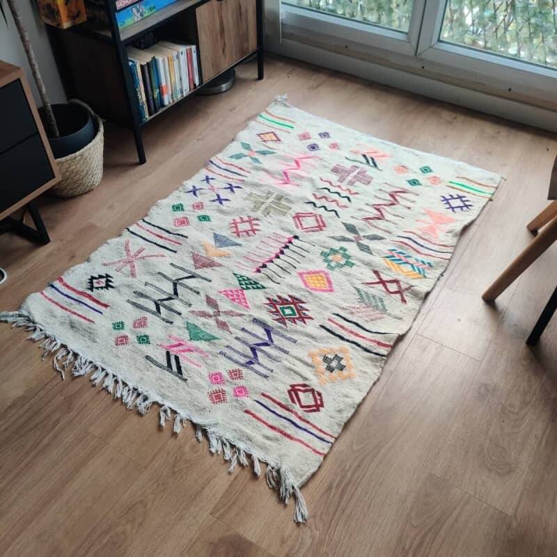 White Moroccan rug with Berber patterns.
