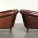 Set of 2 sheepskin club armchairs in a dark cognac colour