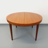 Large vintage Scandinavian round table from the 50s 60s in teak with extensions