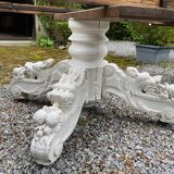 White lacquered oak table, richly carved central leg. Late 19th century