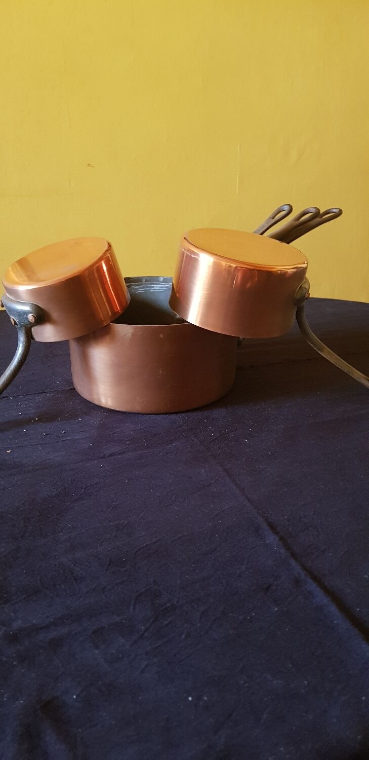 Series of 5 tinned copper saucepans. Great height.