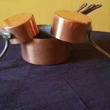 Series of 5 tinned copper saucepans. Great height.