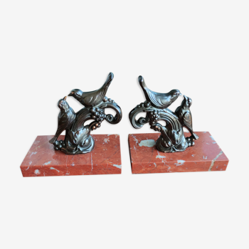 Zinc art bookends in the shape of birds on red marble - warblers