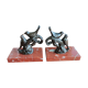 Zinc art bookends in the shape of birds on red marble - warblers