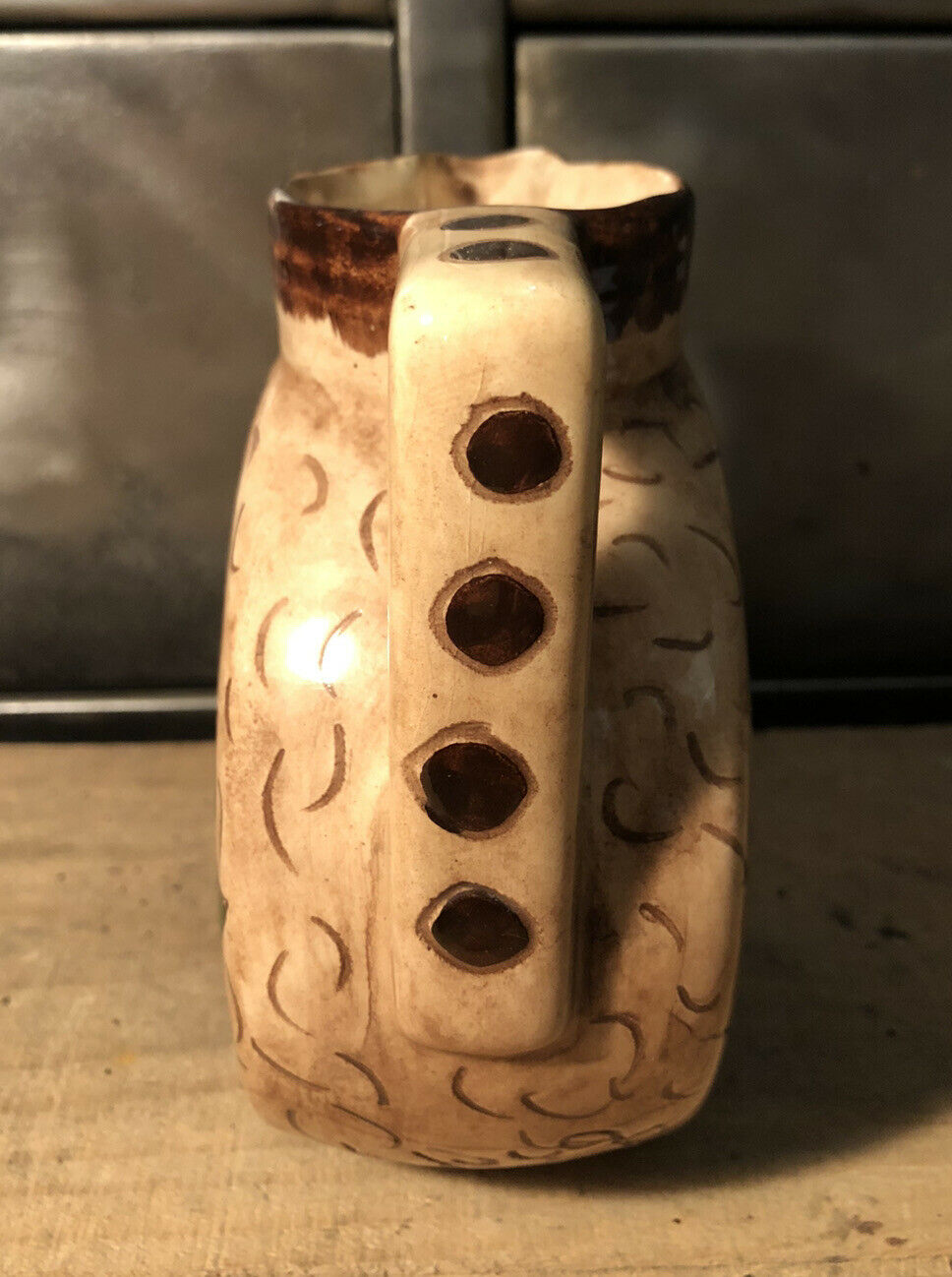 Ceramic pitcher with floral decoration signed Lucq