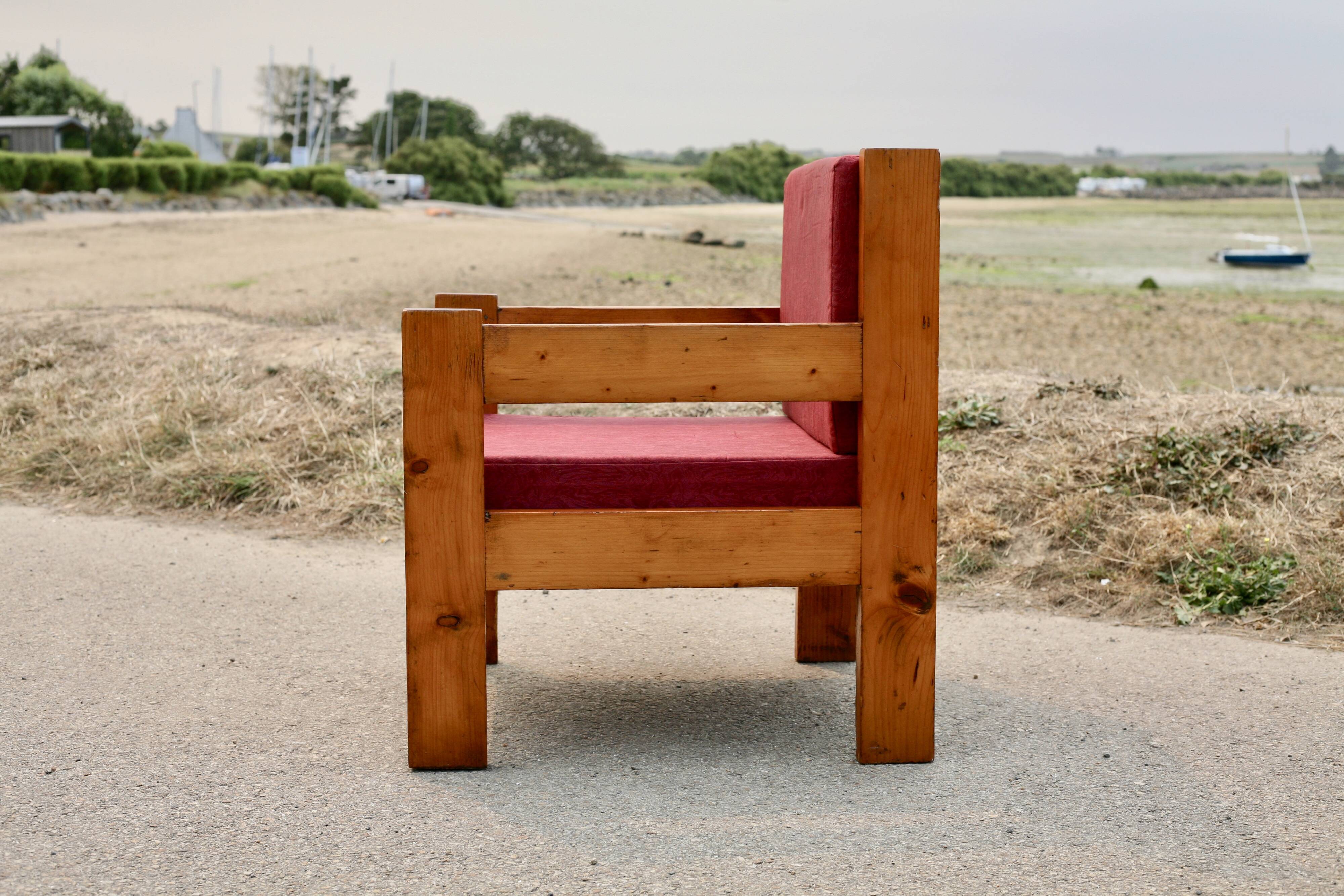 Pair of pine fireside chairs, France, 1960s, "raspberry" cushions