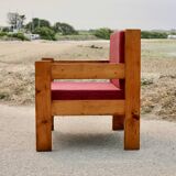 Pair of pine fireside chairs, France, 1960s, "raspberry" cushions