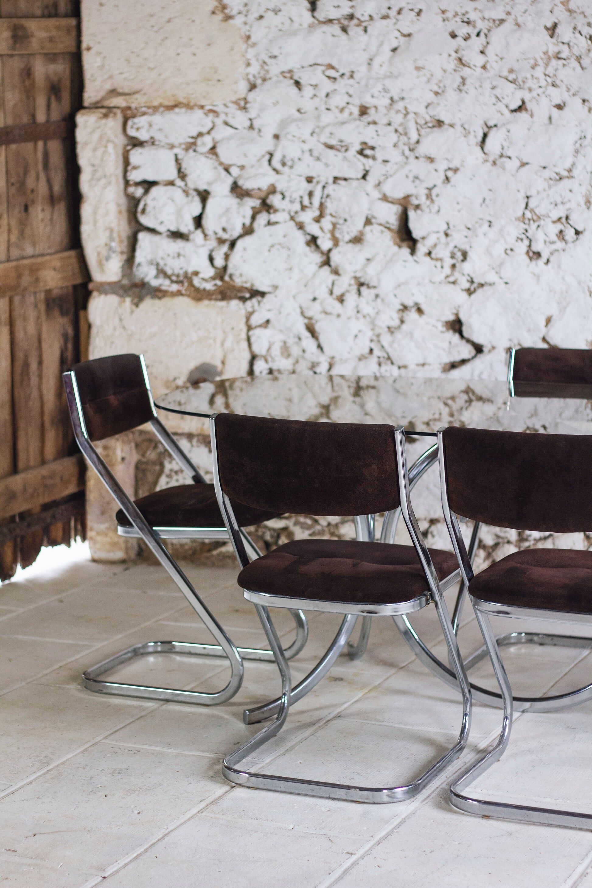 Chrome and smoked glass dining table in the style of Gastone Rinaldi, 1970.