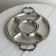 Vintage silver-plated metal serving tray with compartments.