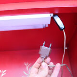 Black and red chinoiserie wardrobe – illuminated vintage furniture