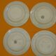 Set of 4 flat plates in saint amand earthenware. lily of the valley decor.