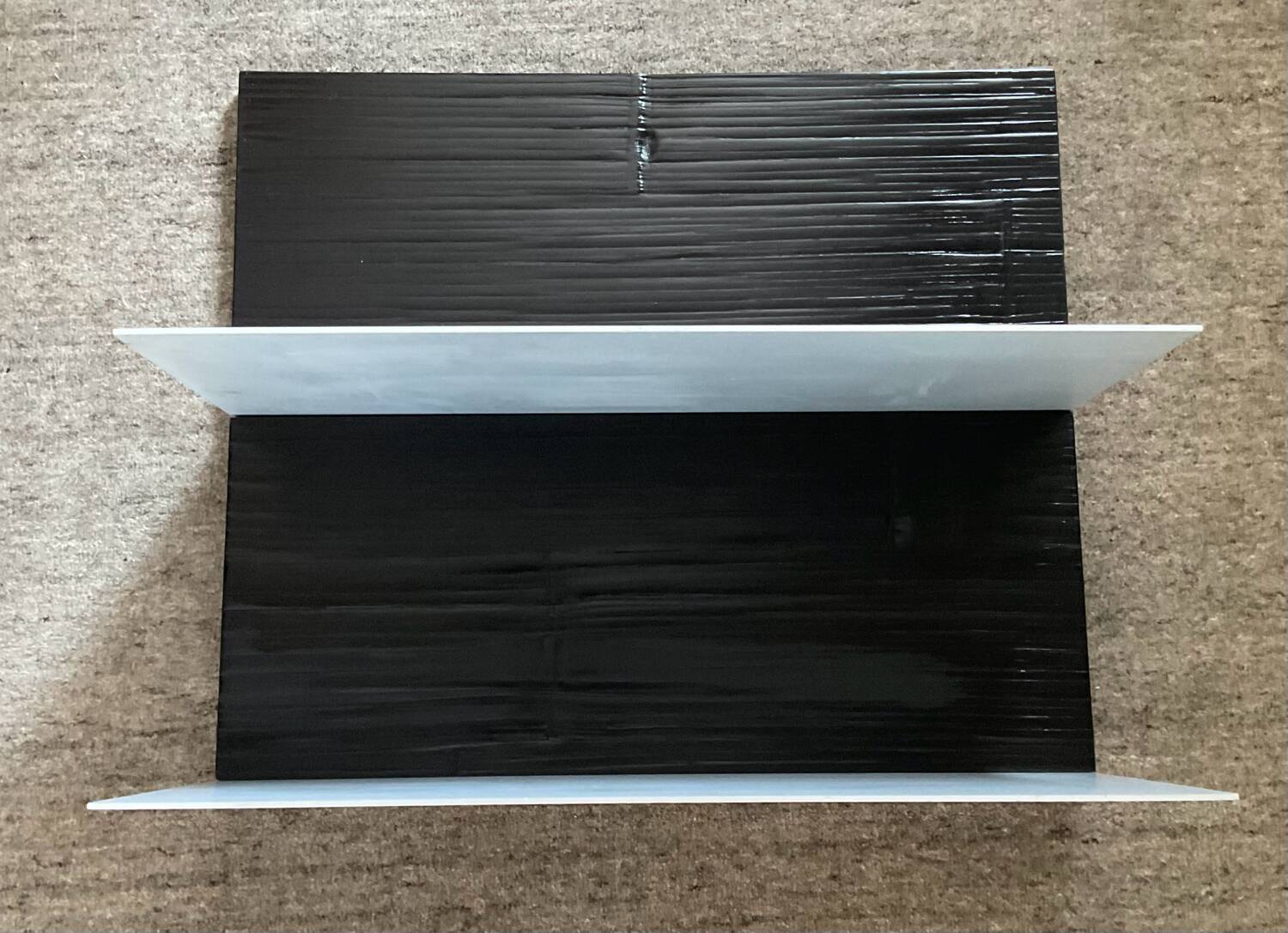 Pair of contemporary shelves in steel and stained wood