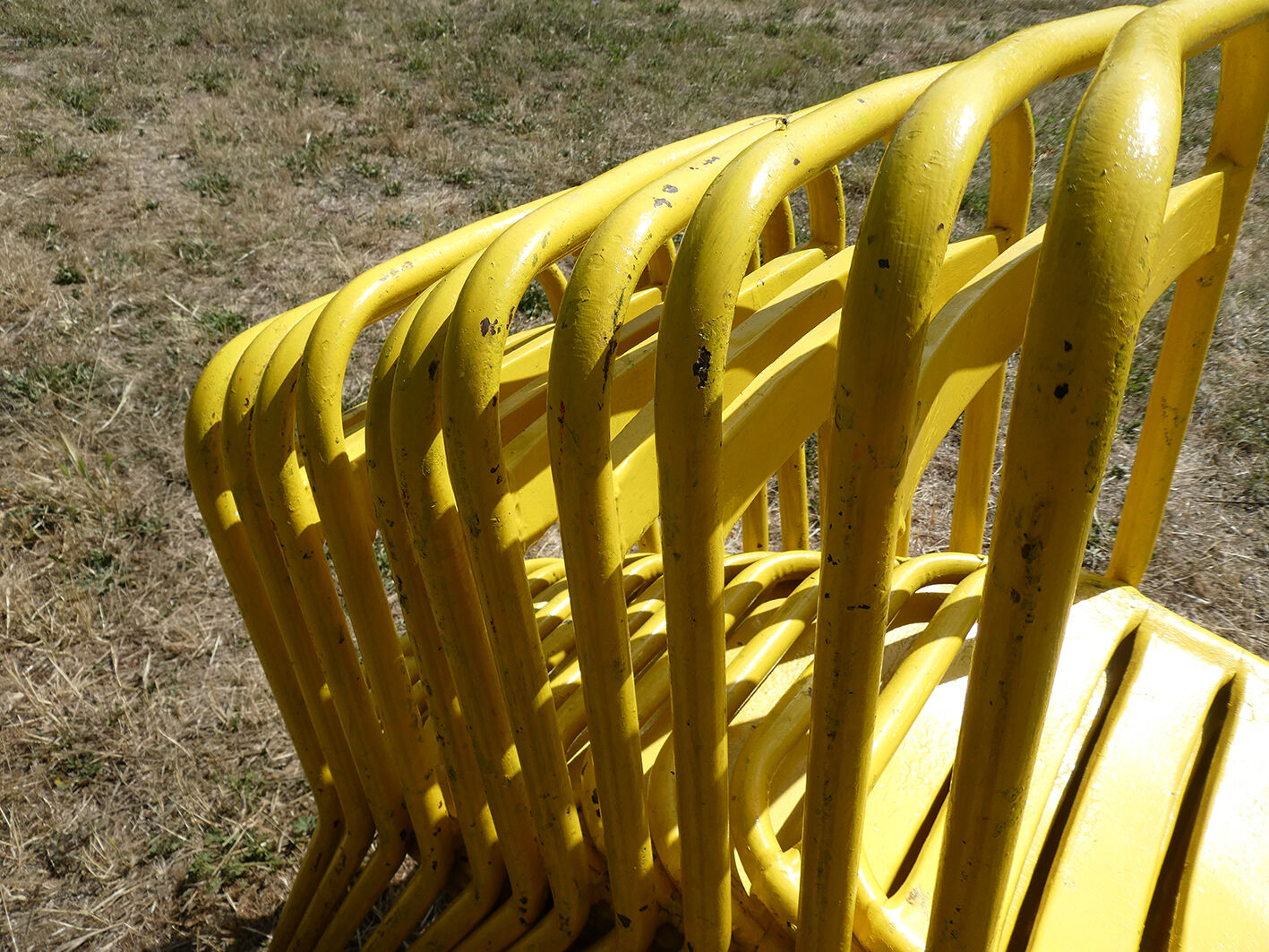Lot of 11 yellow metallic bistro chairs from the 1950s