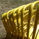 Lot of 11 yellow metallic bistro chairs from the 1950s