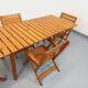 Salon de jardin vintage composé d’une table avec rallonges et 4 fauteuils