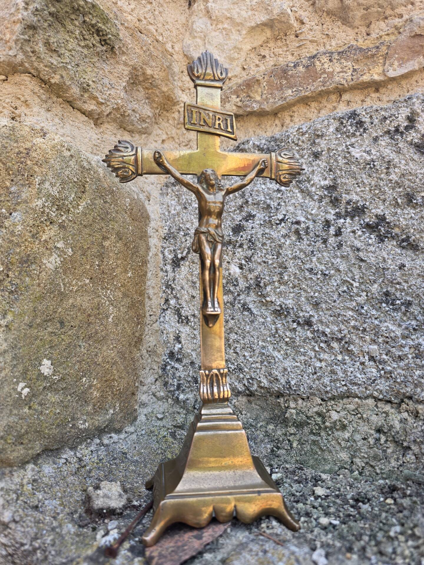 19th-century brass crucifix on a base