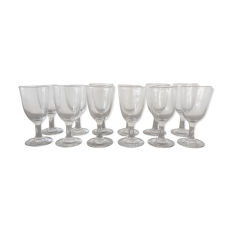Suite of 12 blown-foot glasses, early 20th