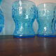 Blue glass carafe and two glasses