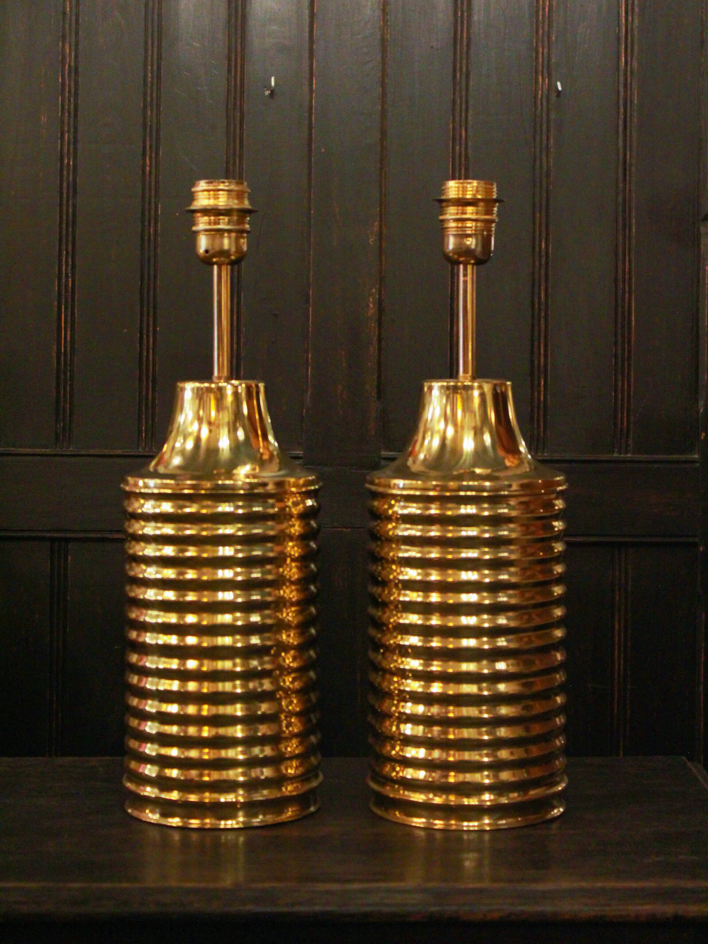 Pair of lamps in gilded brass