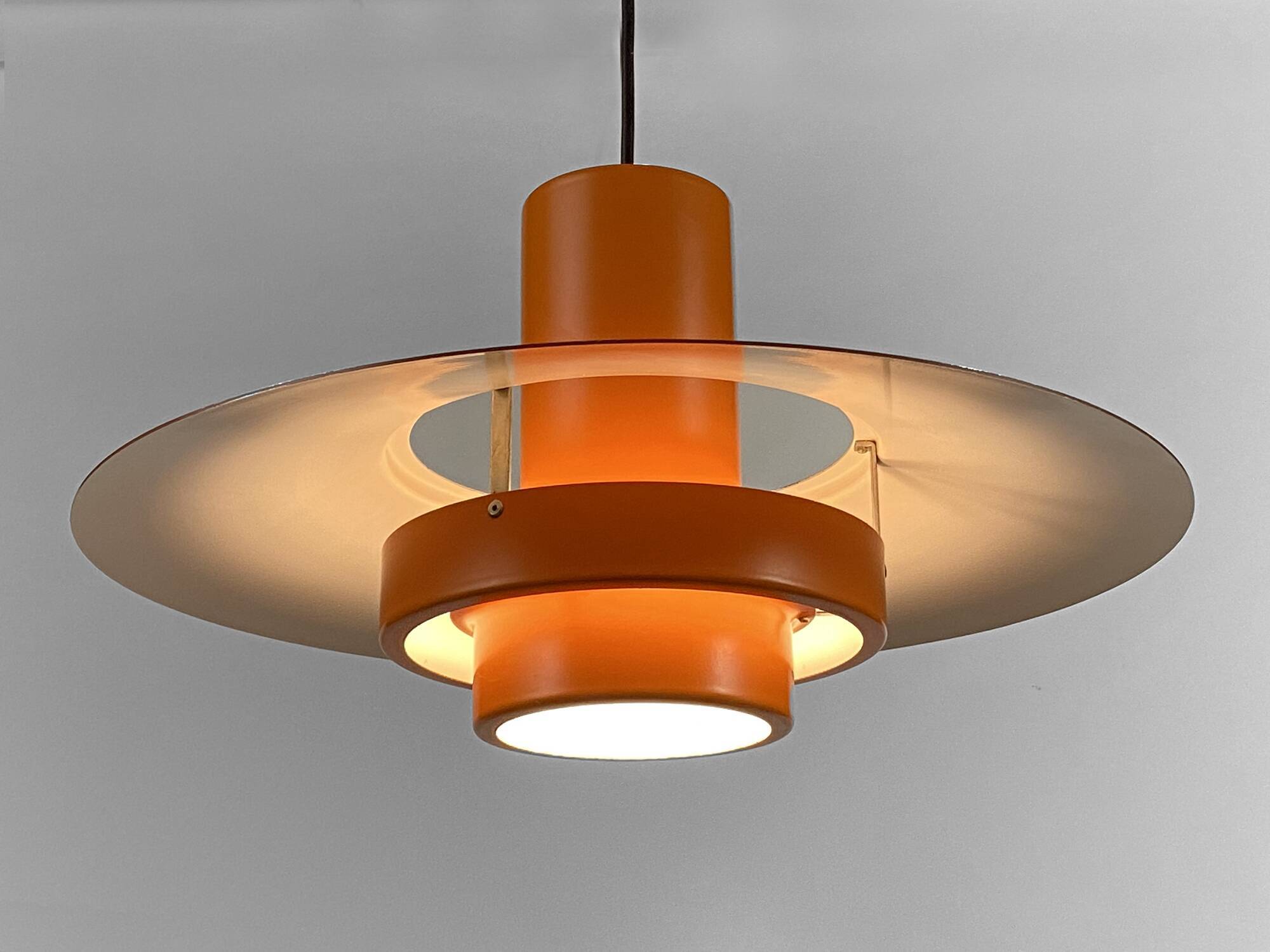 Pendant light "Falcon" two tone orange by Andreas Hansen for Fog & Mørup. Denmark 1960s.