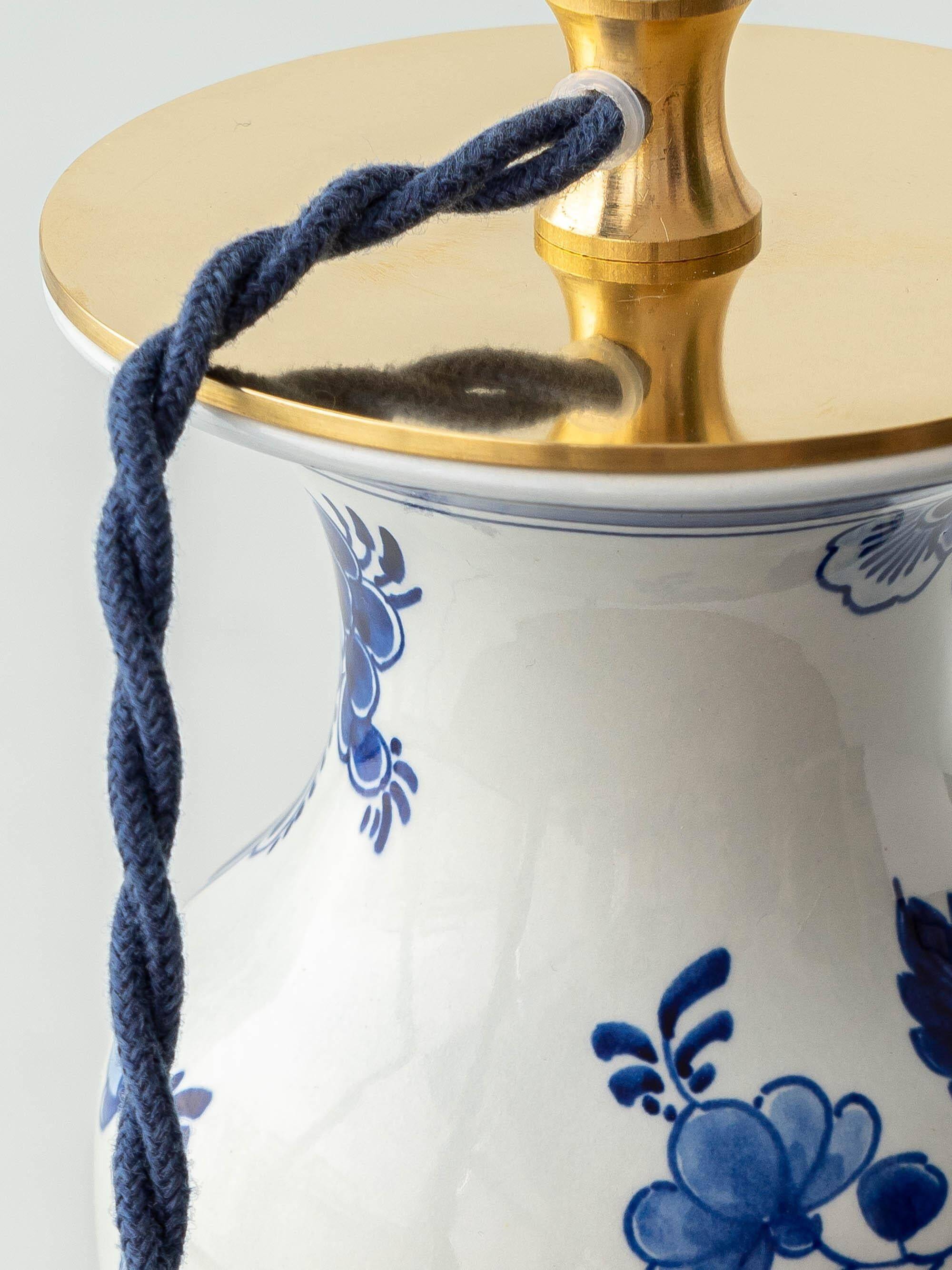 Pair of Chinese table lamps in Delft blue ceramic with new green silk shades.