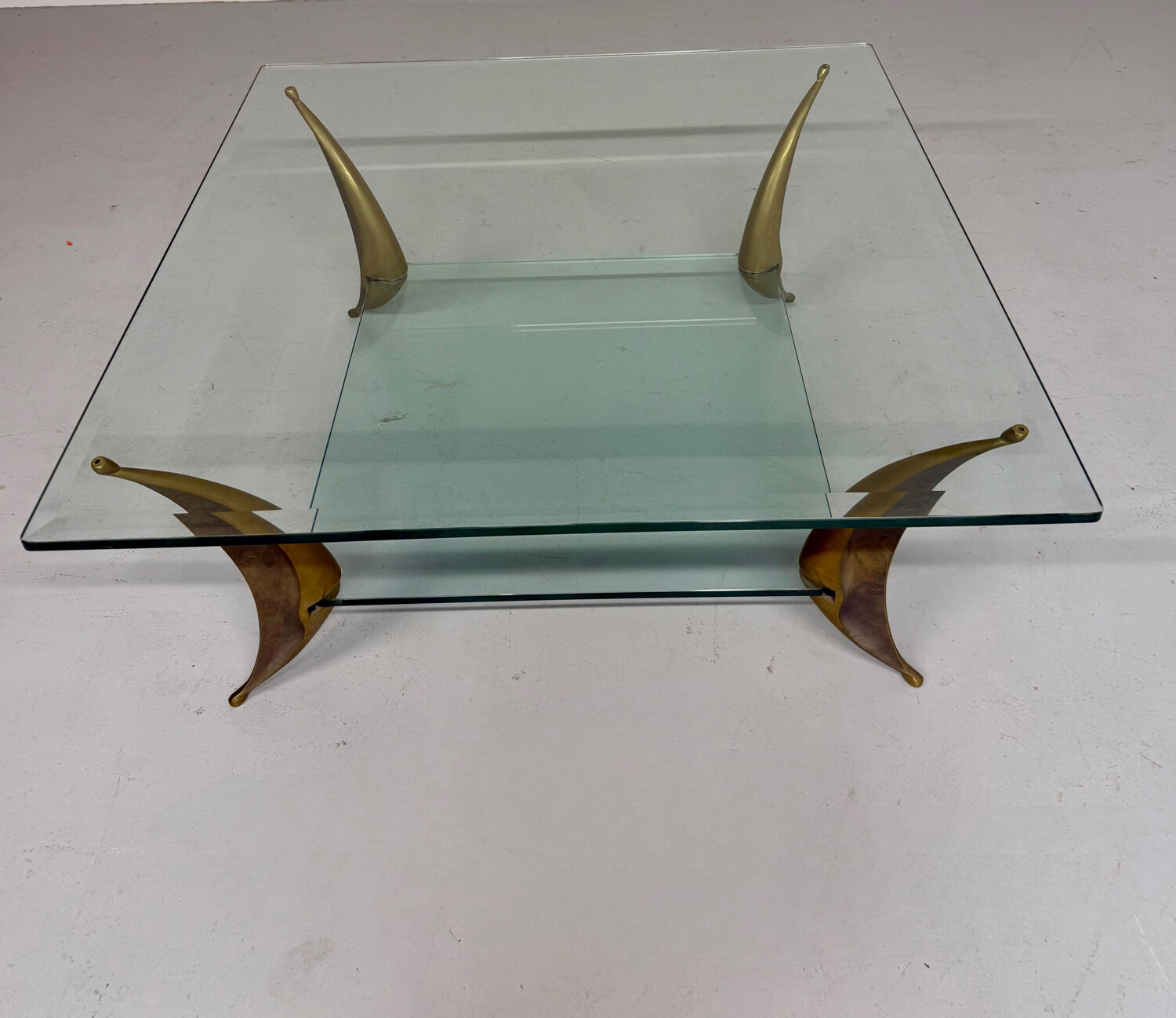Glass coffee table with solid brass legs, Italian design from the 60s