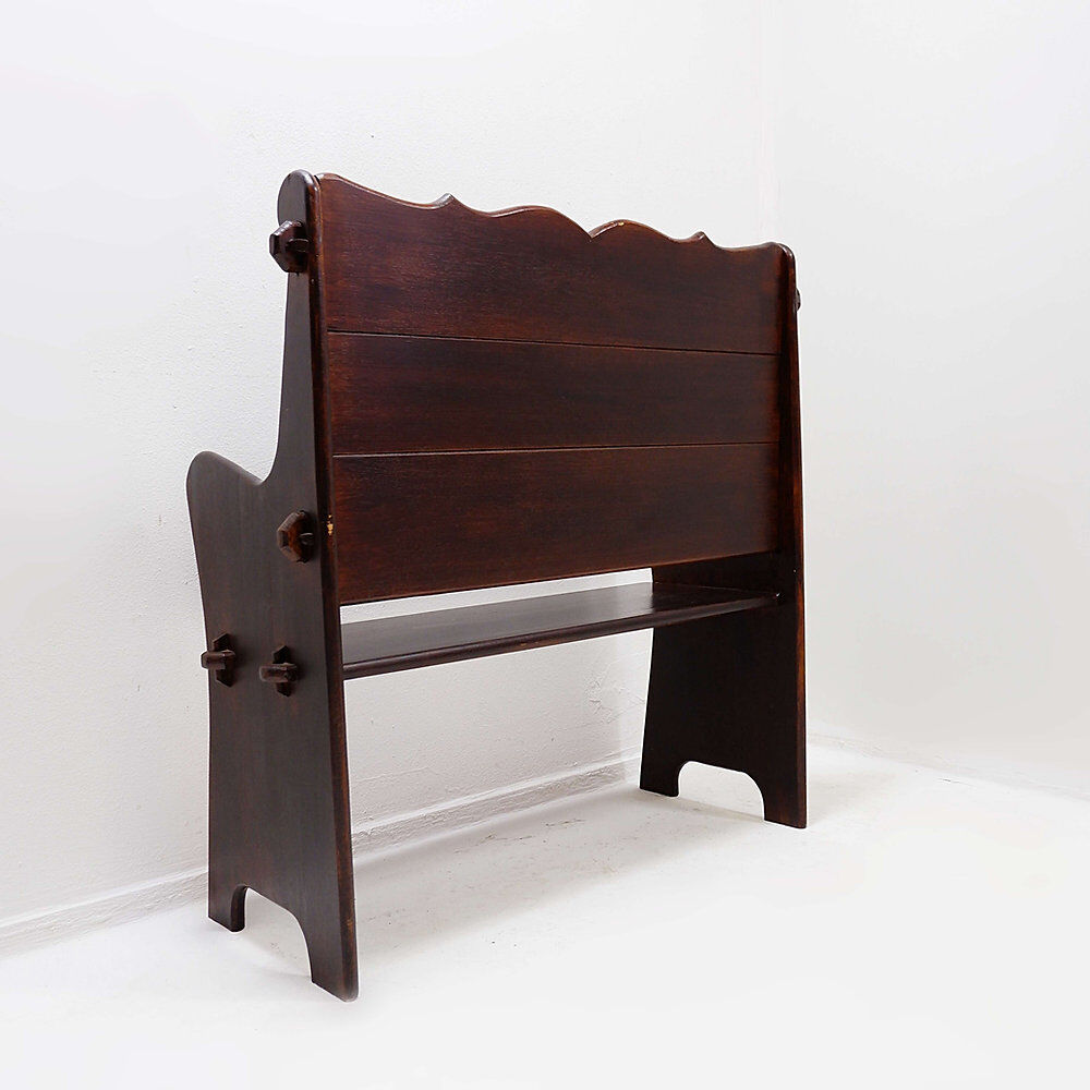 Vintage solid wood church bench from the 20th century.