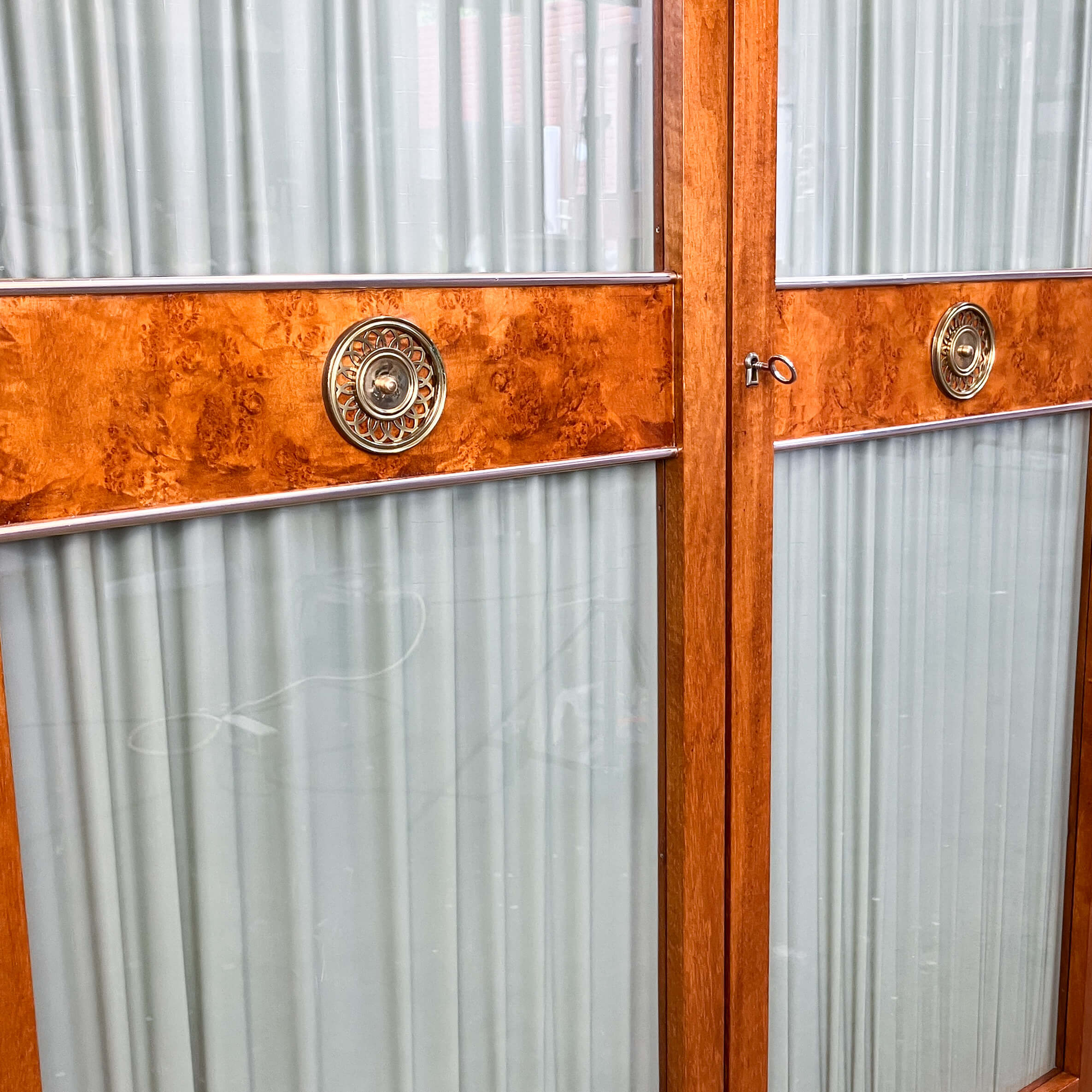 Art Deco cabinet with glass doors, various woods, 1930s