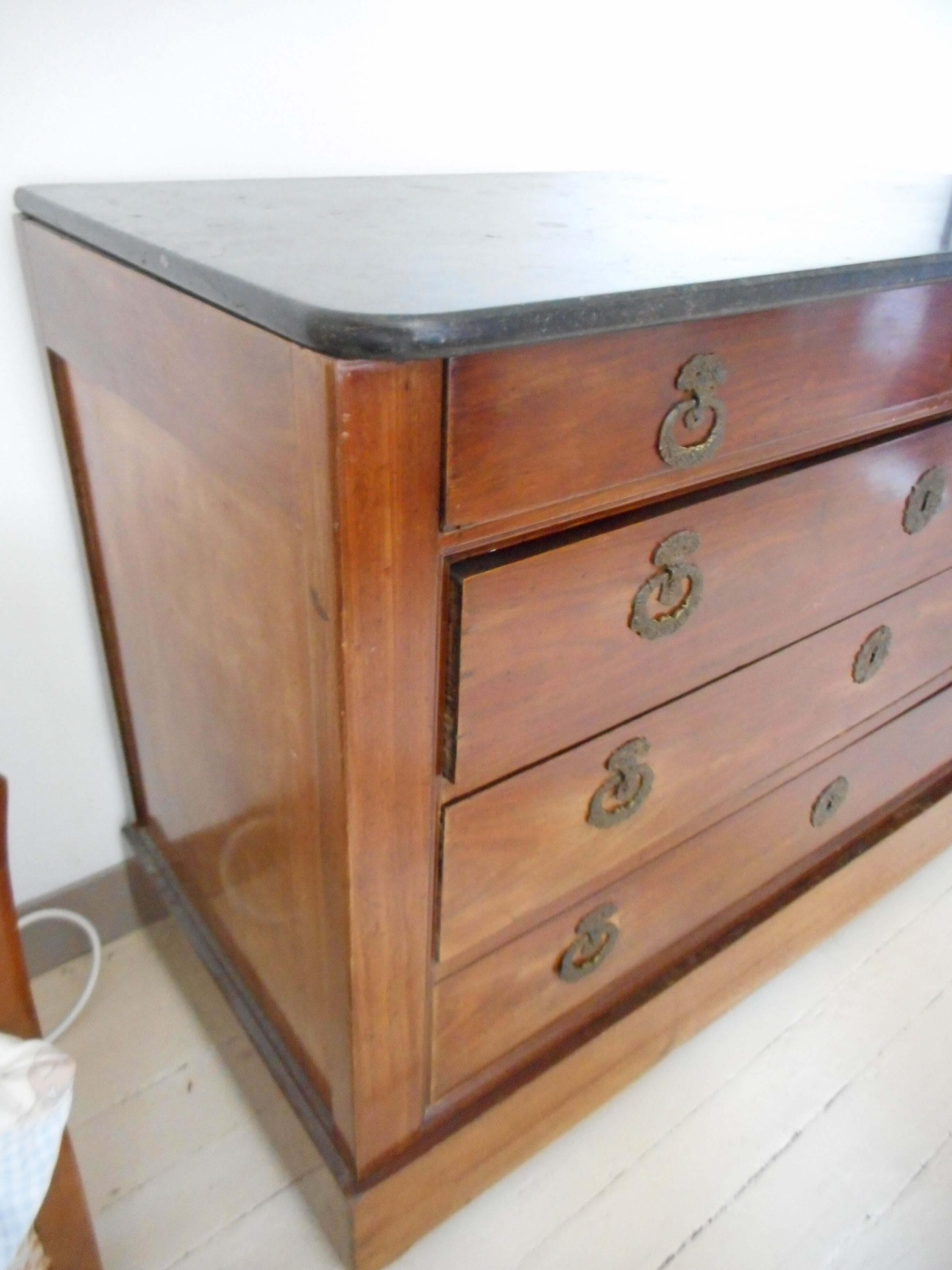 Old chest of drawers with black marble