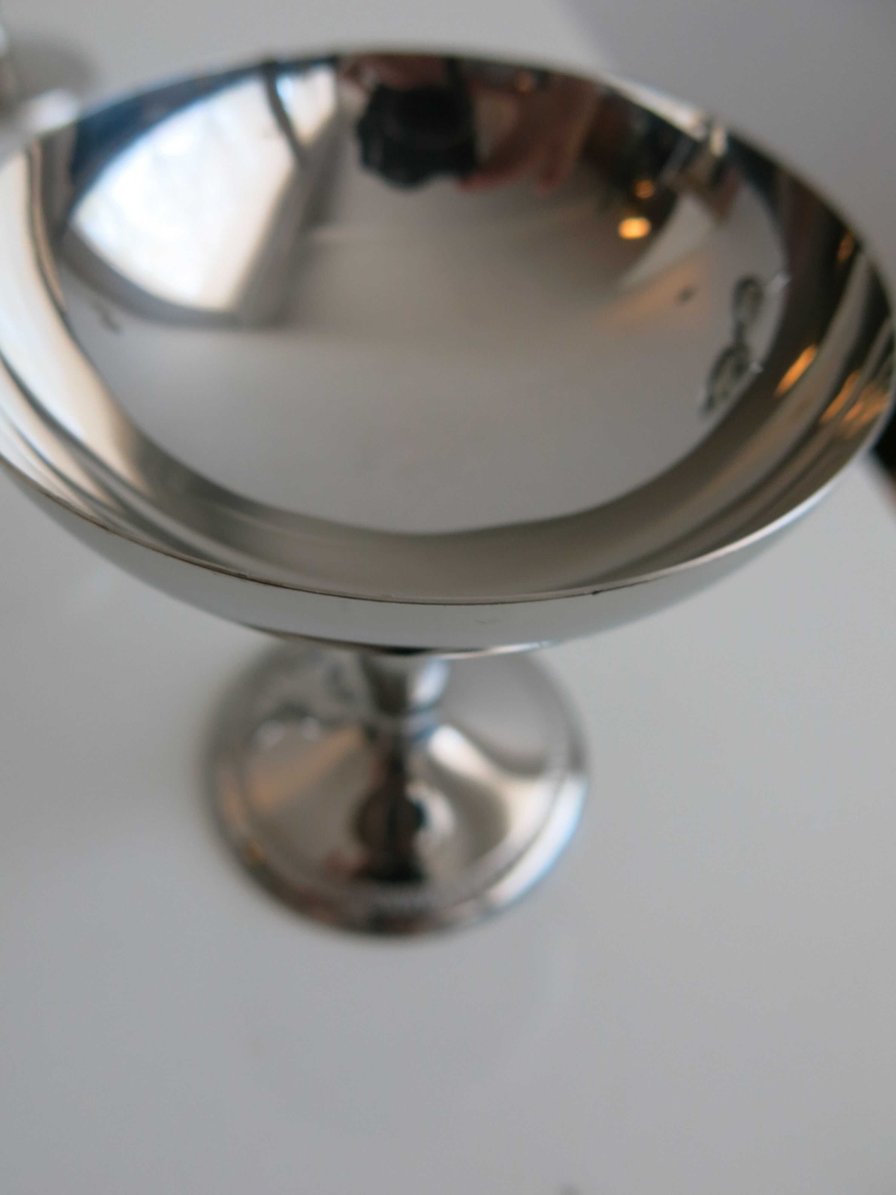 Set of six stainless steel standing cups