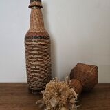 Glass and rattan bottle
