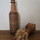 Glass and rattan bottle