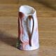 Vintage carafe in colorful fish slip