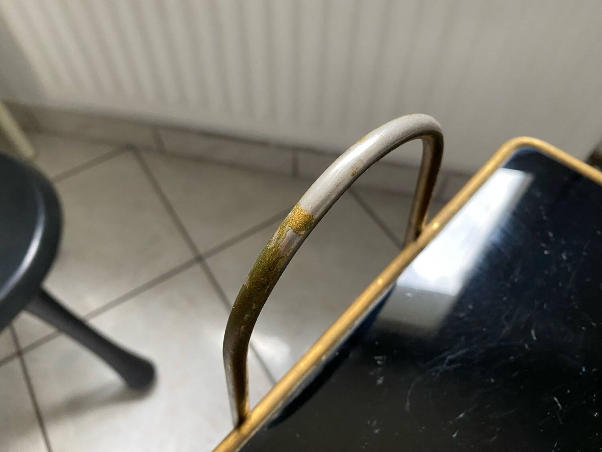 Vintage 1960s brass and smoked glass side table with magazine holder.