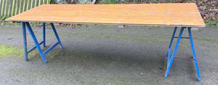 Farm wooden tavern table on trestles