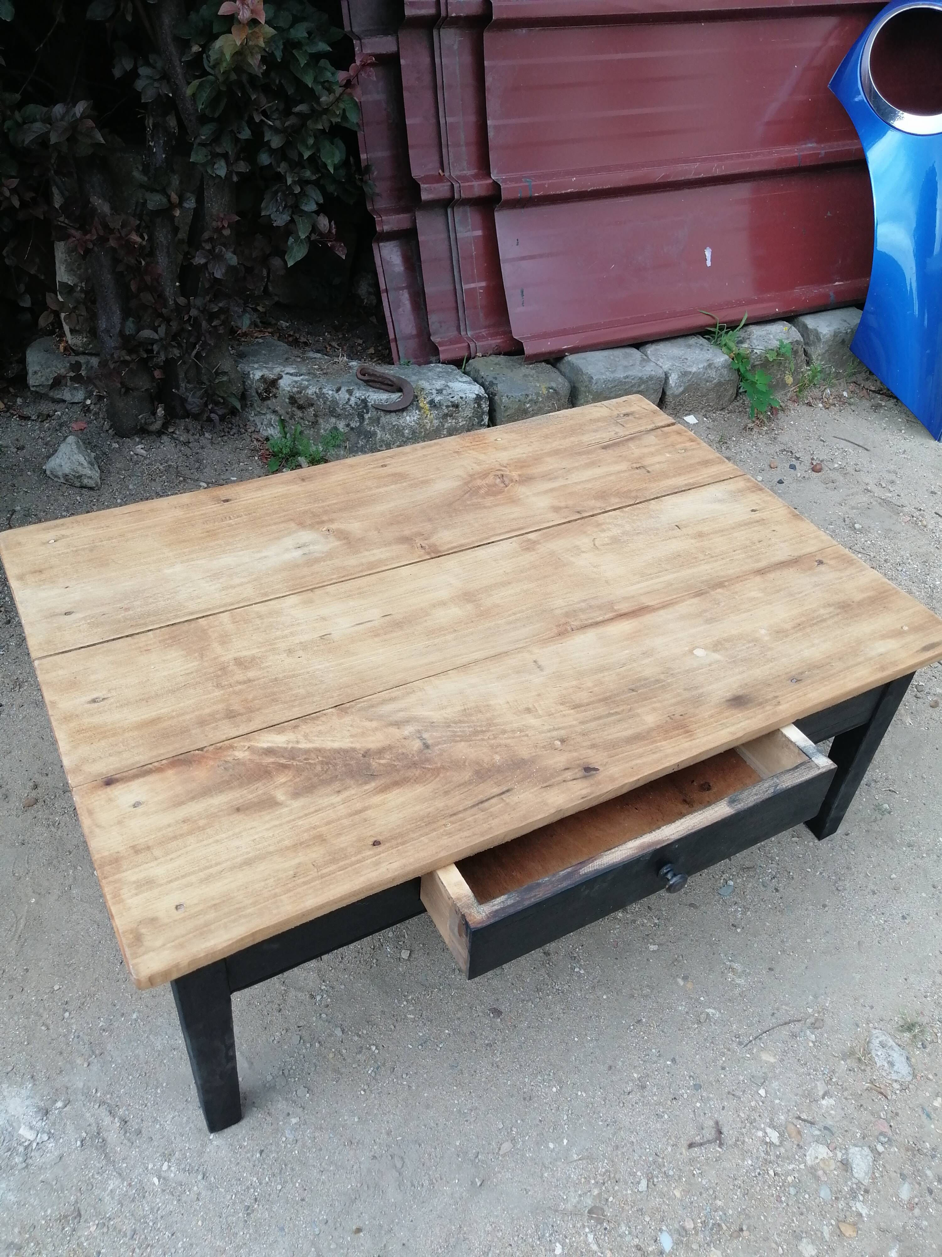 Wooden coffee table with a drawer