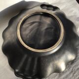 Undulating black iridescent ceramic cut