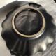 Undulating black iridescent ceramic cut