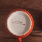 2 small orange cups made in Czechoslovakkia